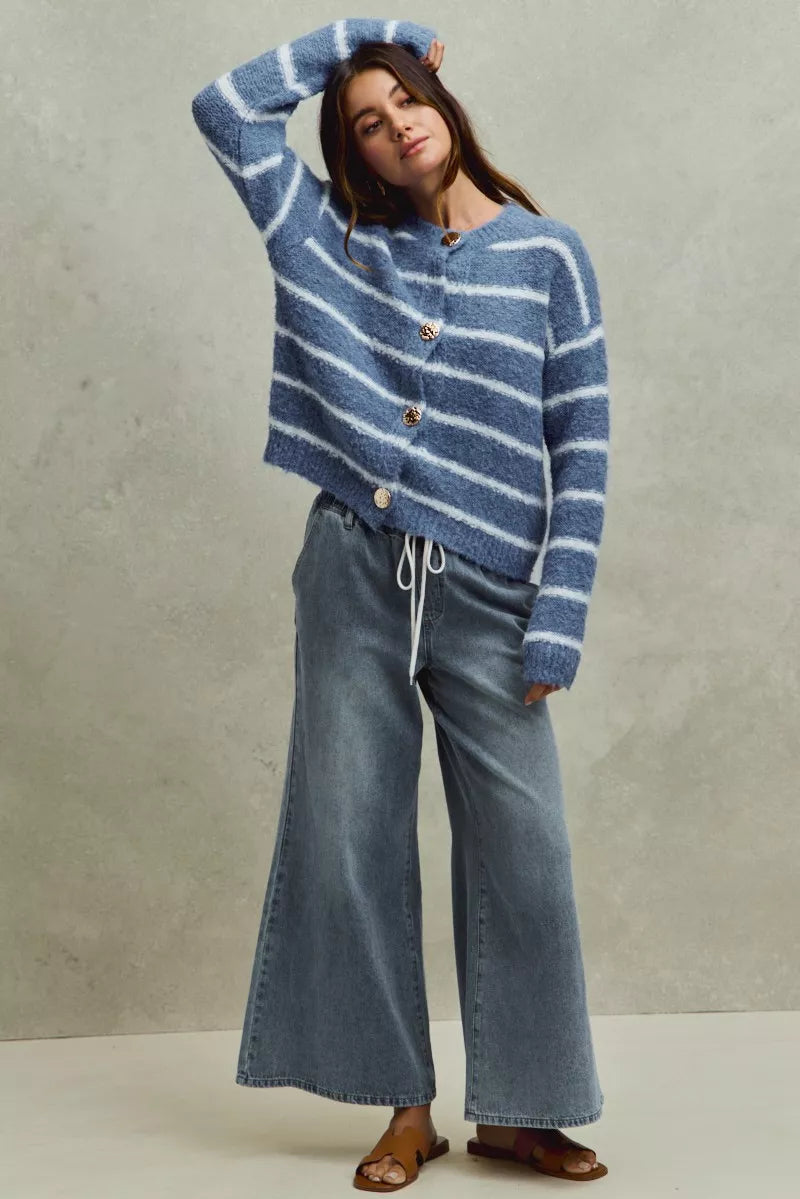 Flare jeans hem detail over shoes
