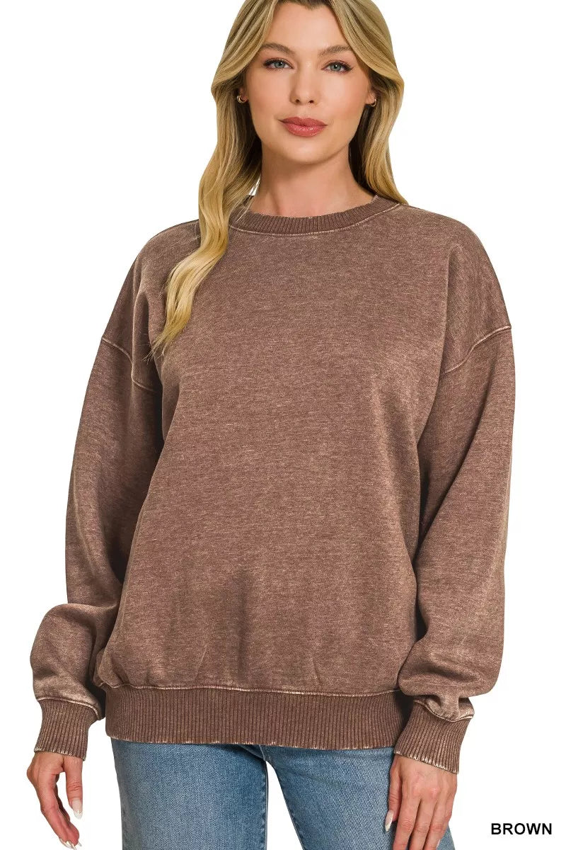 Woman wearing brown fleece acid washed round neck sweatshirt front view