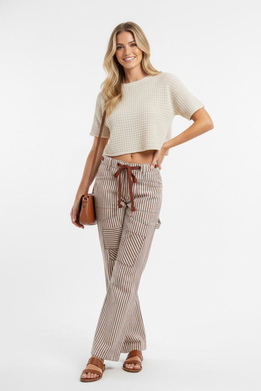 Drawstring waist and pocket detail on striped twill barrel pants