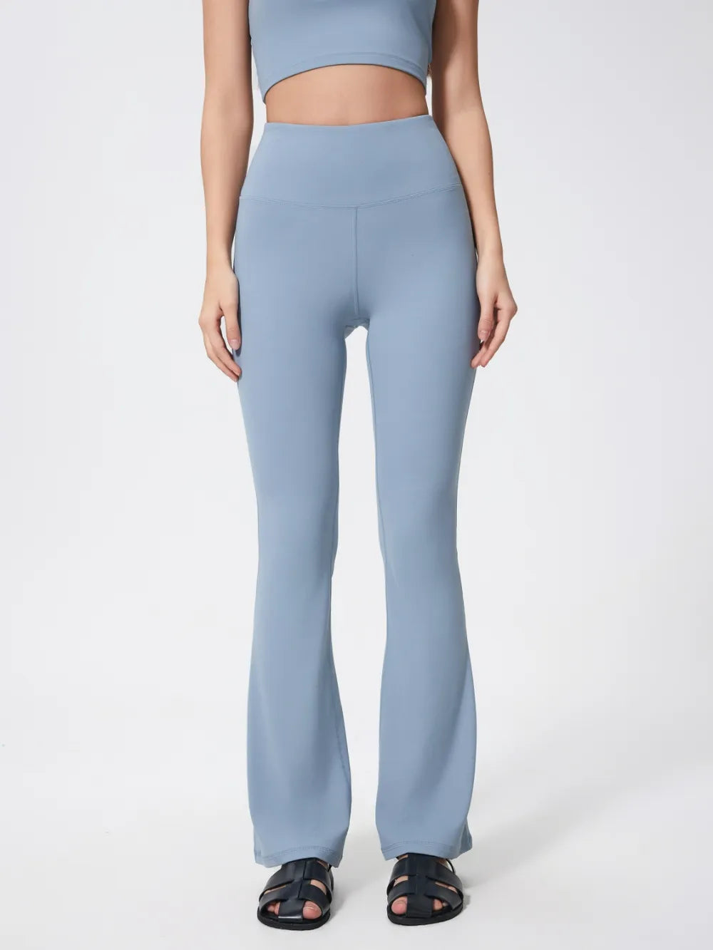 Woman posing in high waist active pants for workout