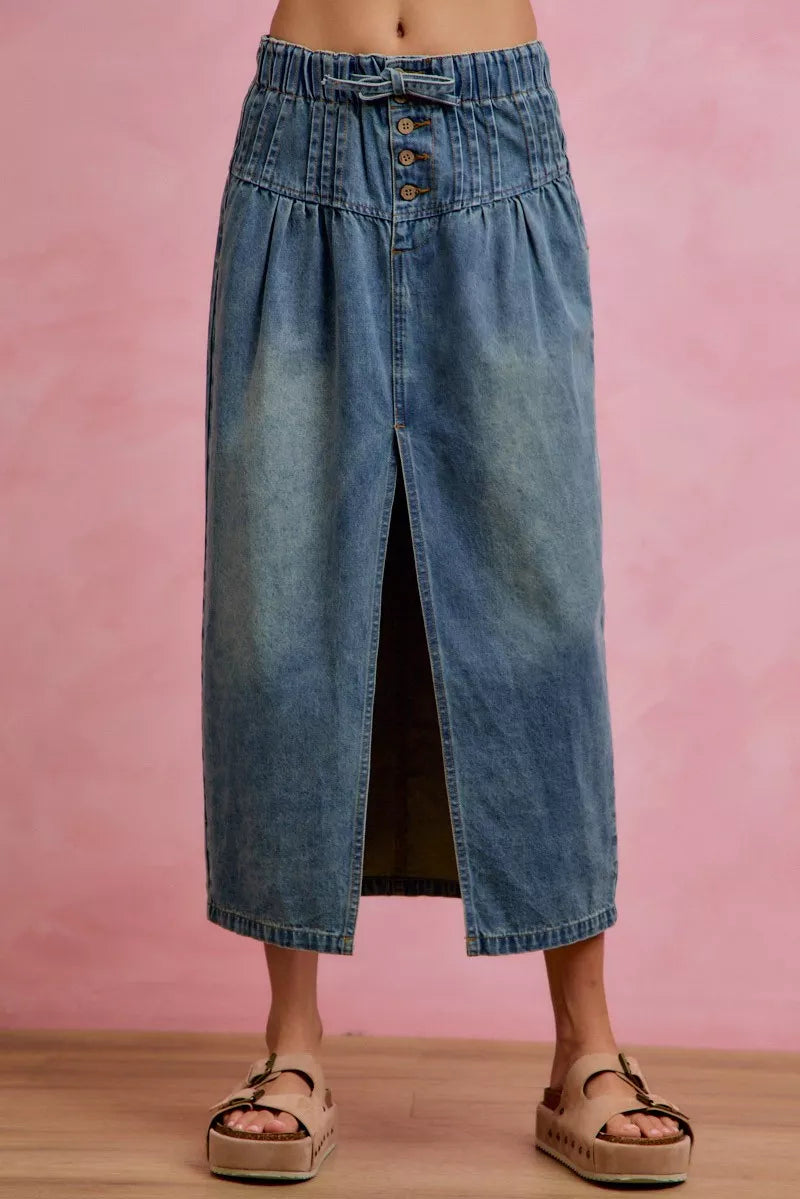 High waisted denim maxi skirt showing front slit