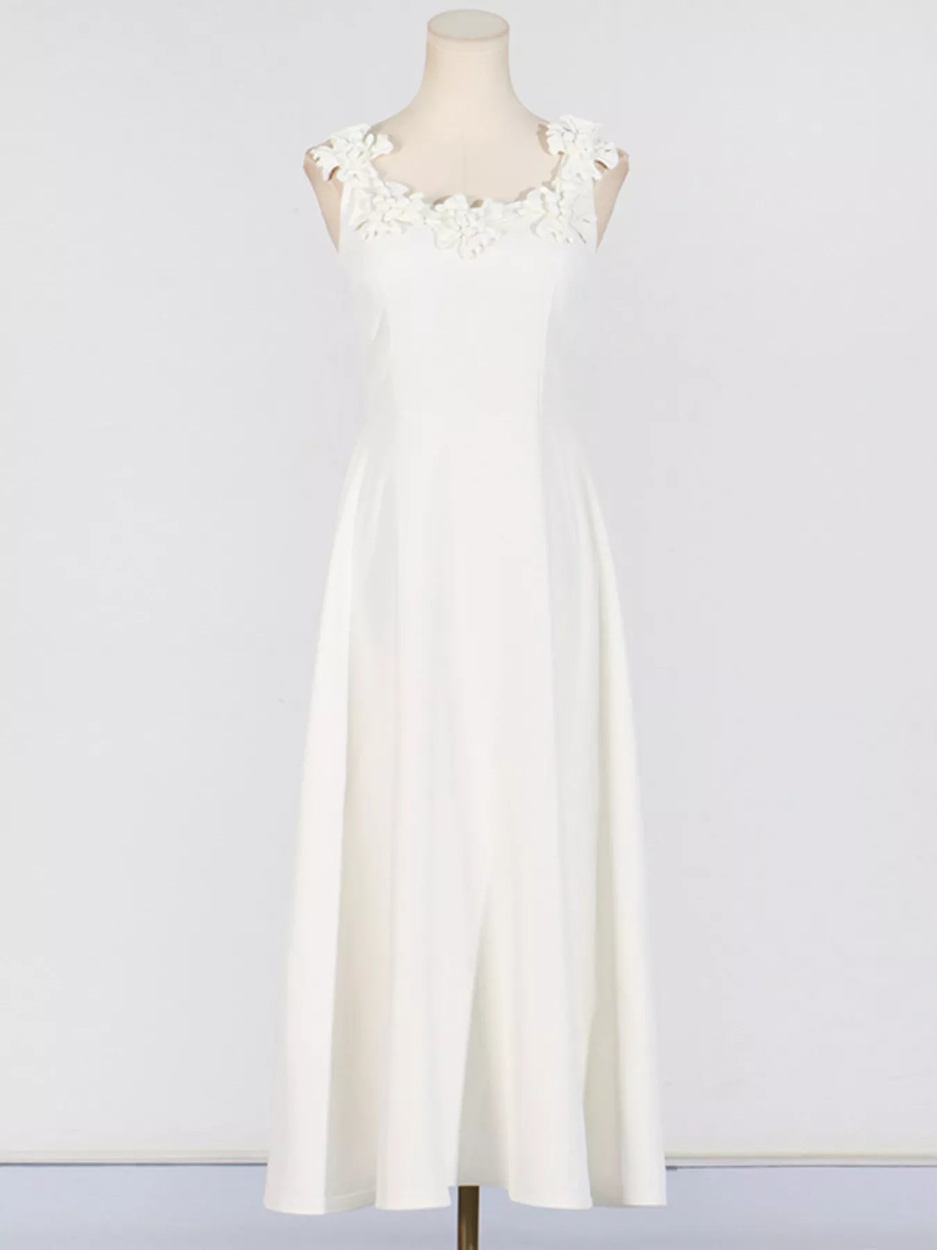 White floral midi dress styled on model