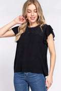Ruffle short sleeve crochet blouse in black front view on model
