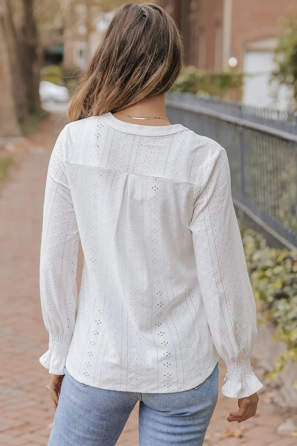 White flounce sleeve blouse side view