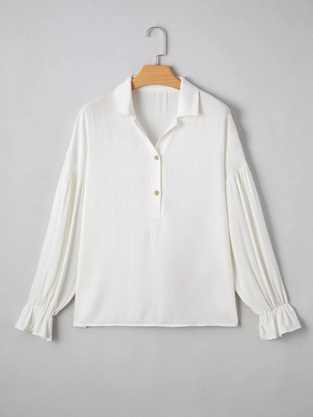 Puffy sleeve blouse three quarter view
