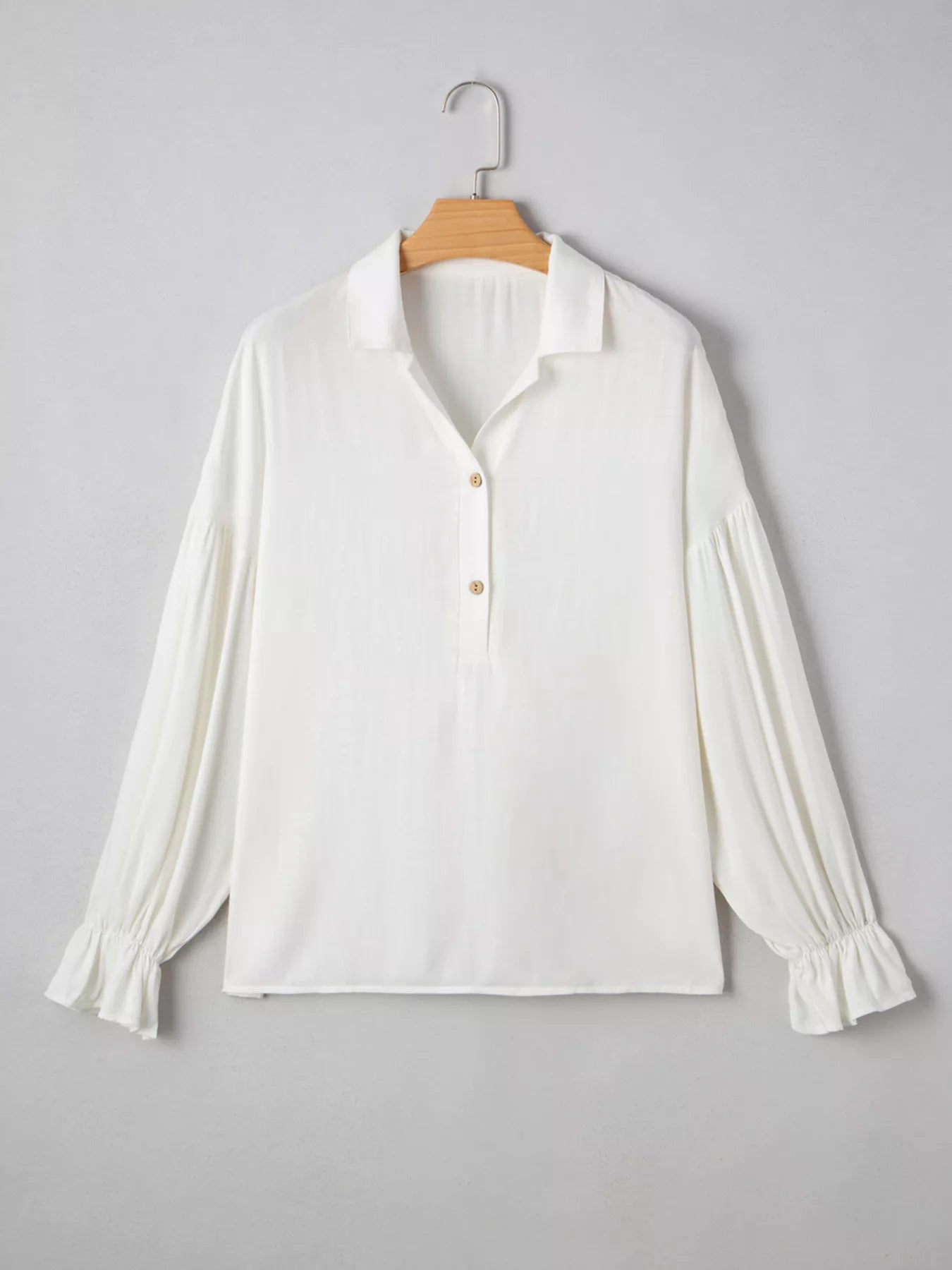 Puffy sleeve blouse three quarter view