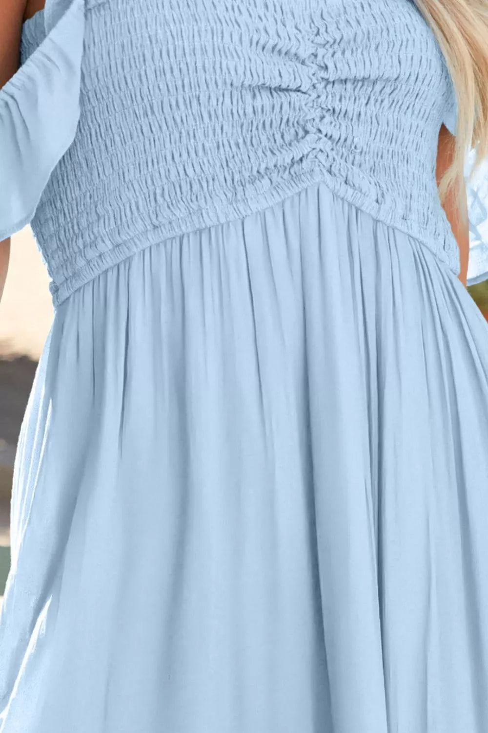 Model wearing light blue off shoulder slit maxi dress