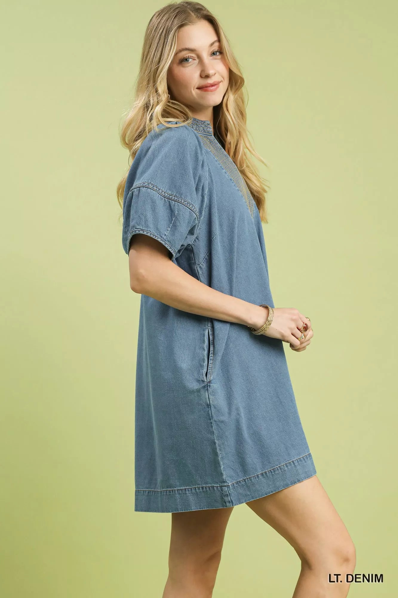 Denim mini dress deep V neckline and puff sleeve detail