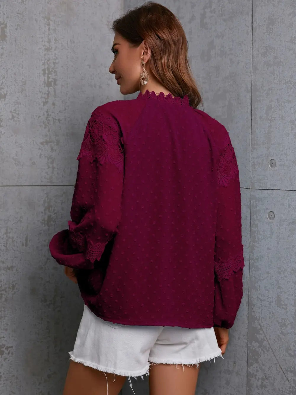 Crochet tie neck long sleeve blouse on model