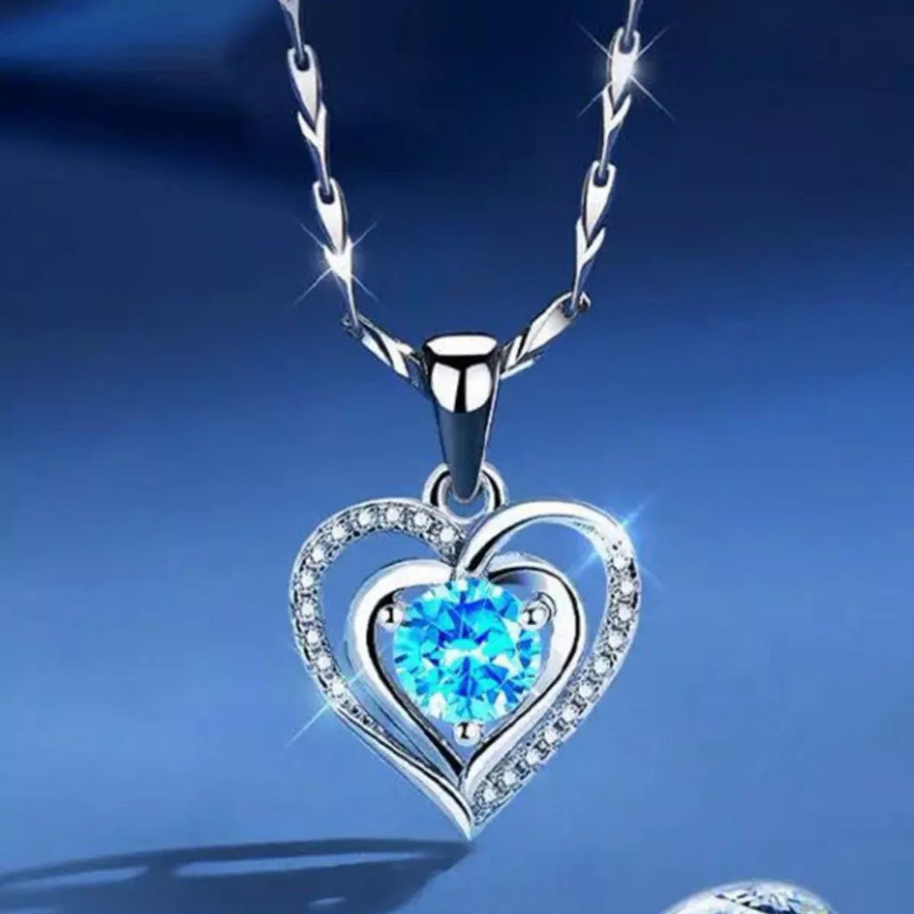 Silver heart pendant necklace close up of charm