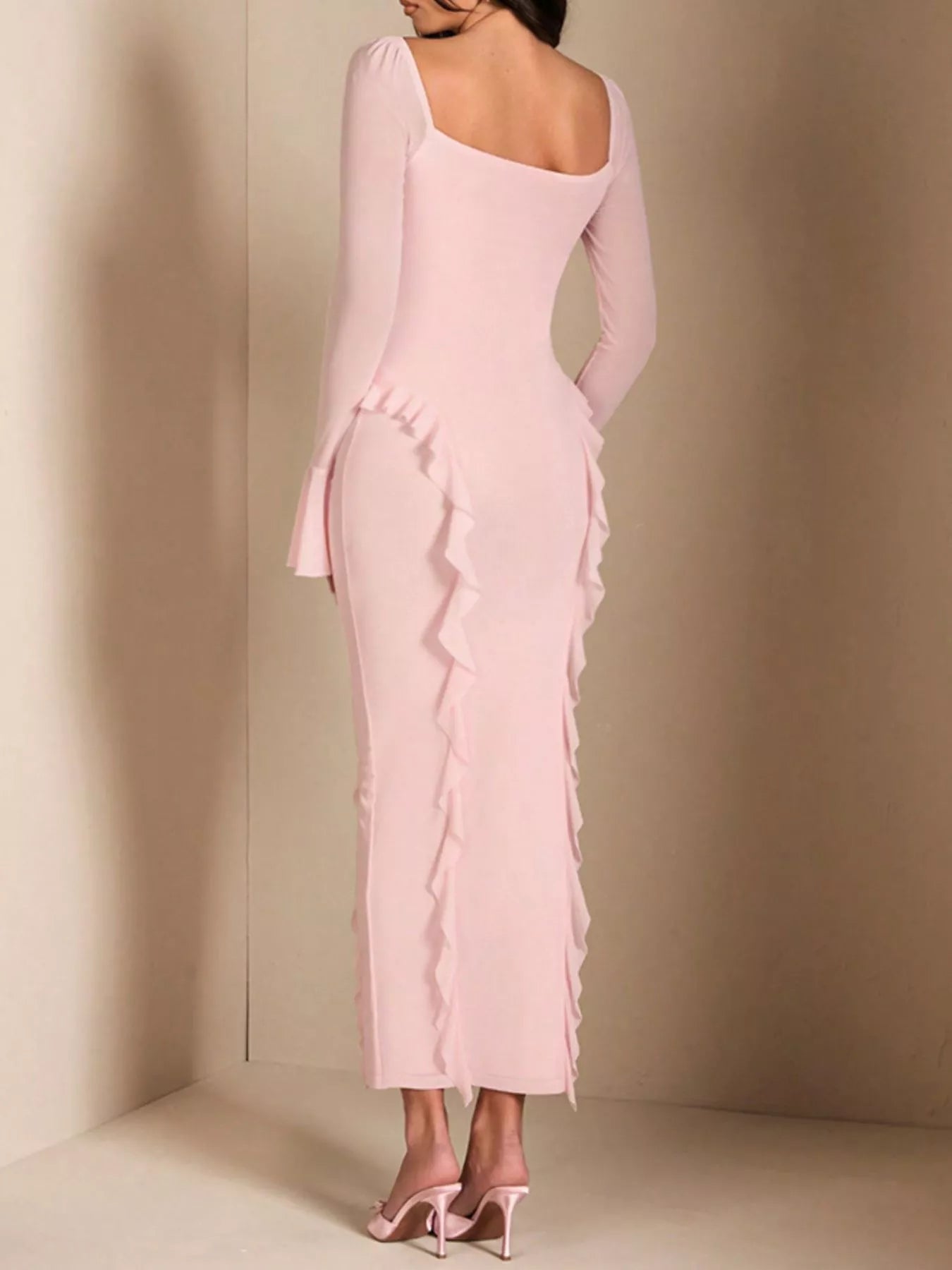Pink floral ruffled maxi dress on model