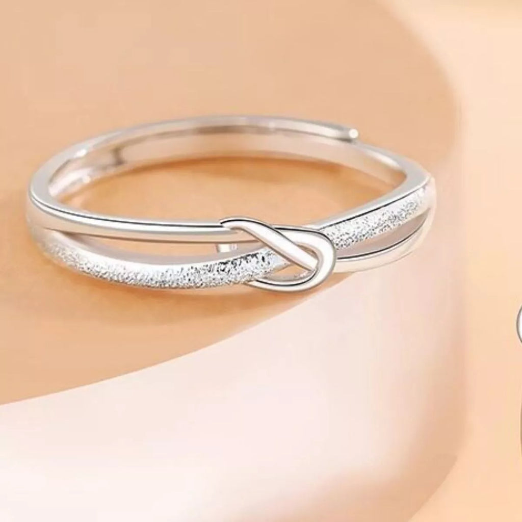 Adjustable sterling silver knot ring close up