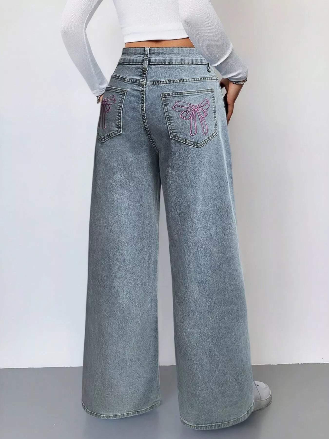 High waist detail on light blue jeans