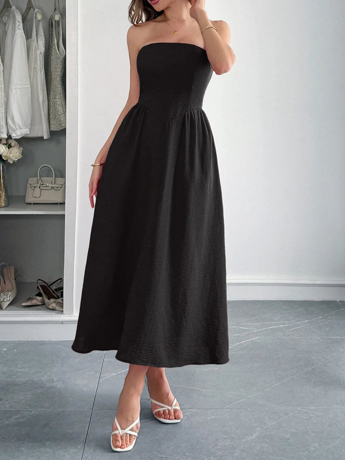 Black strapless midi dress side view on model