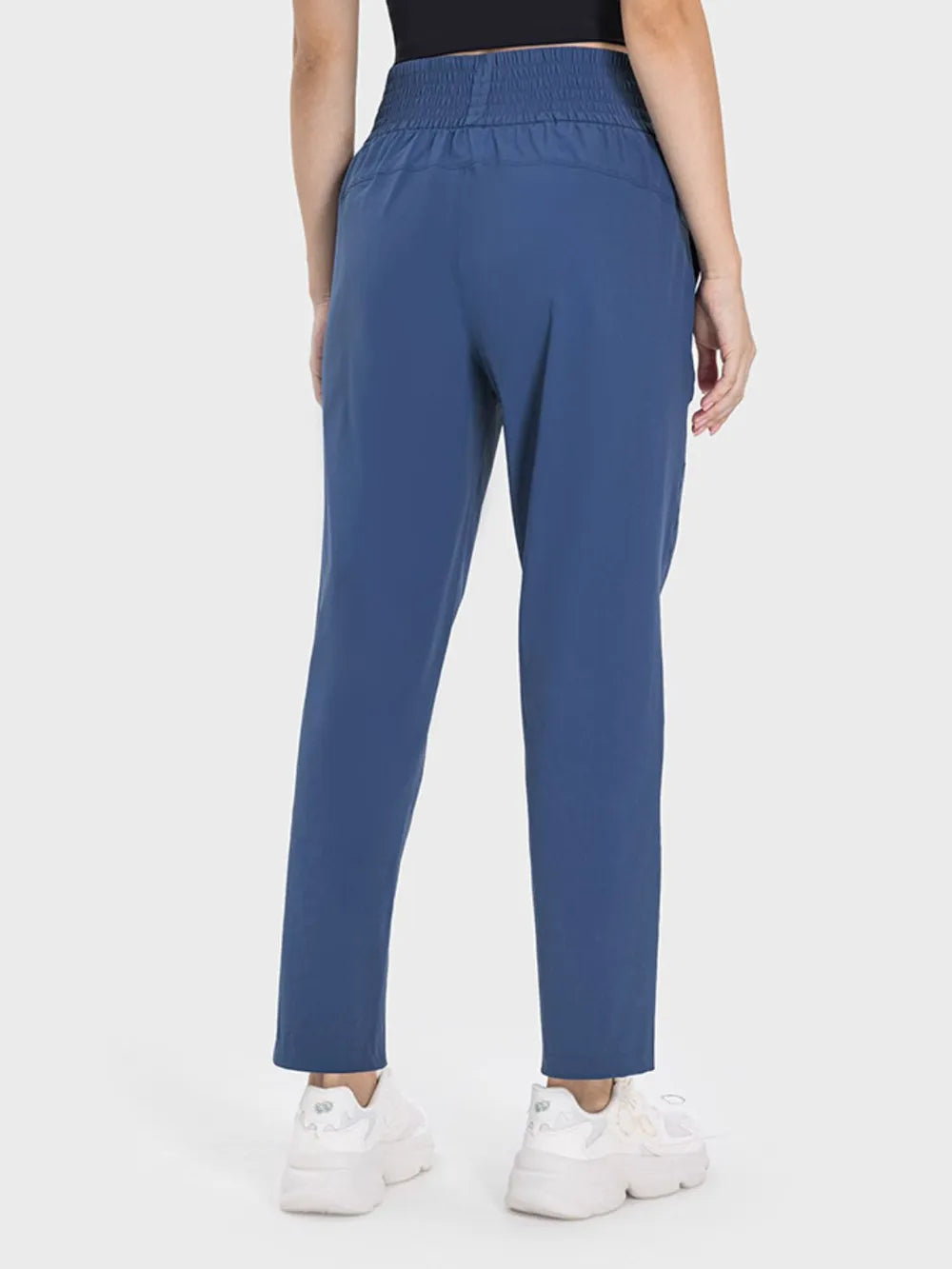 Pocket detail on peacock blue high waist active pants