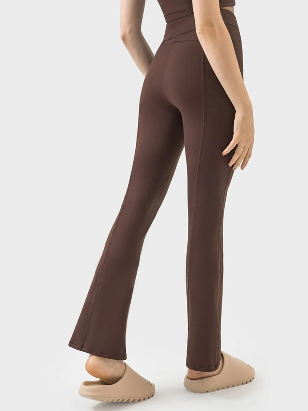 Model posing in zipper detail active pants