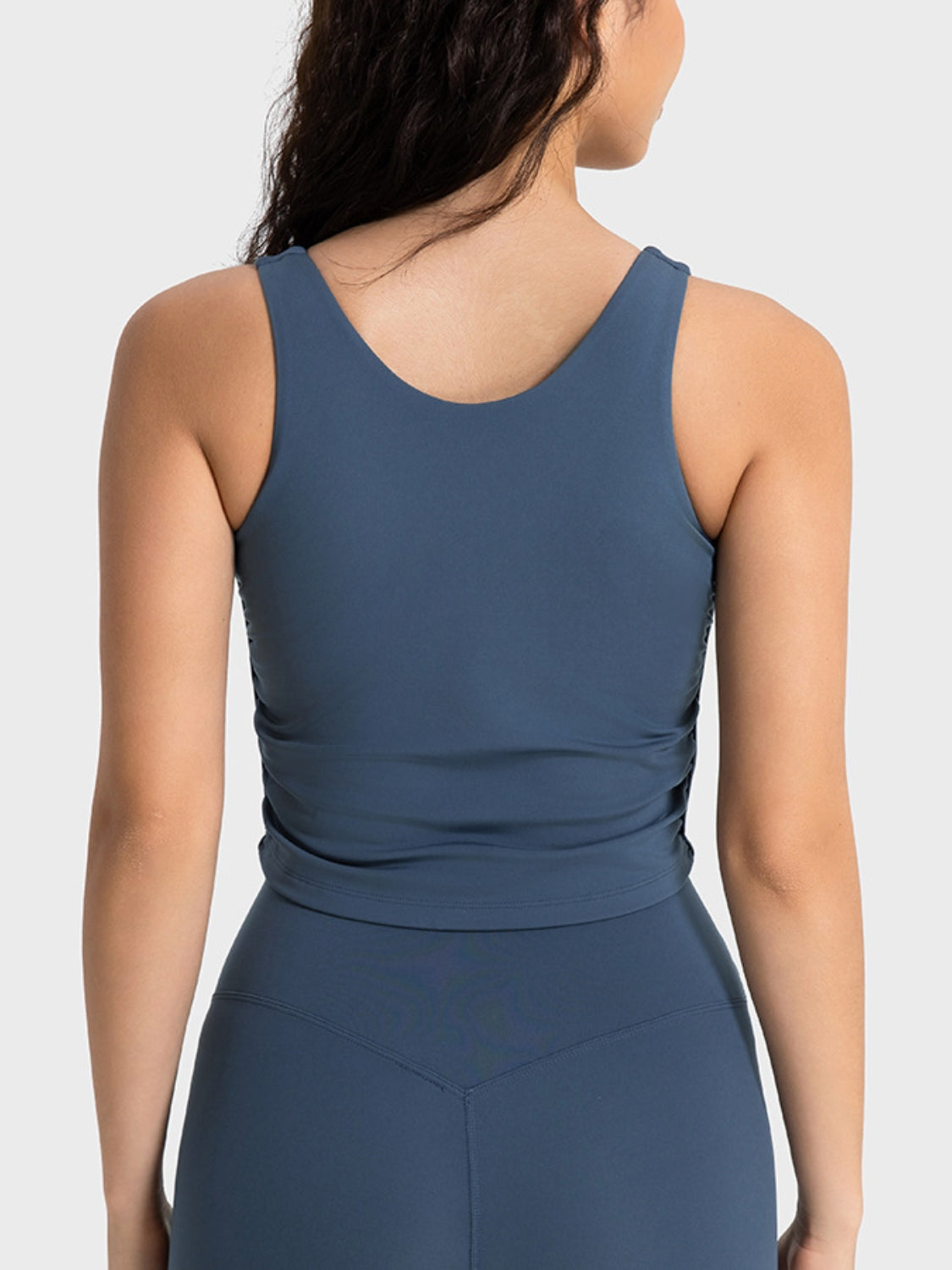 Peacock blue cropped sport tank on model