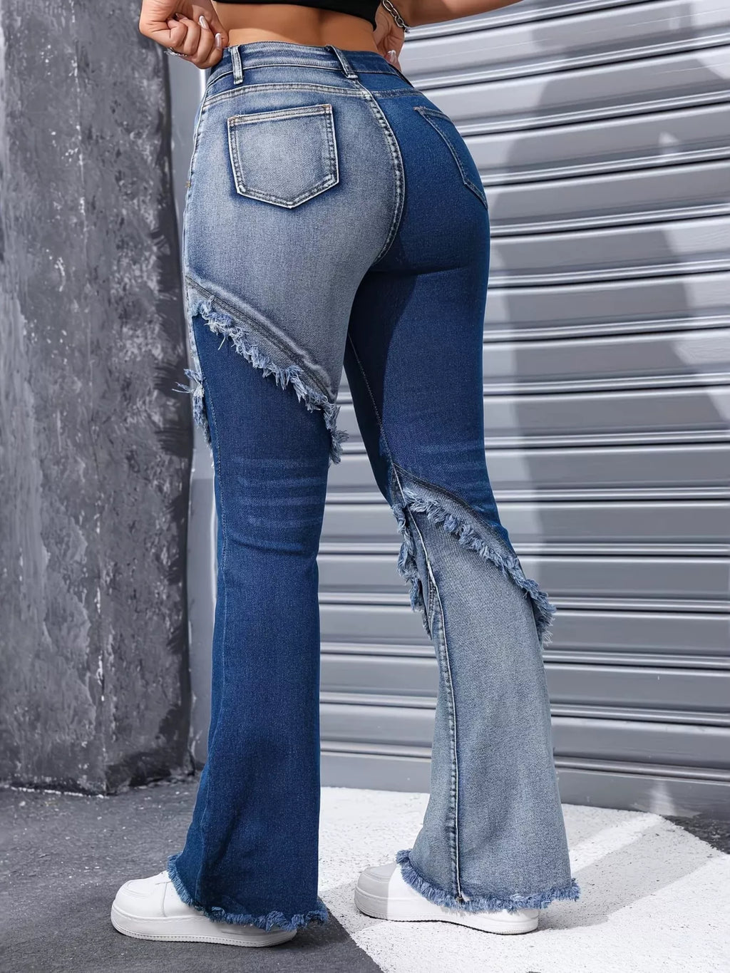 Asymmetrical seam detail on two tone flare denim