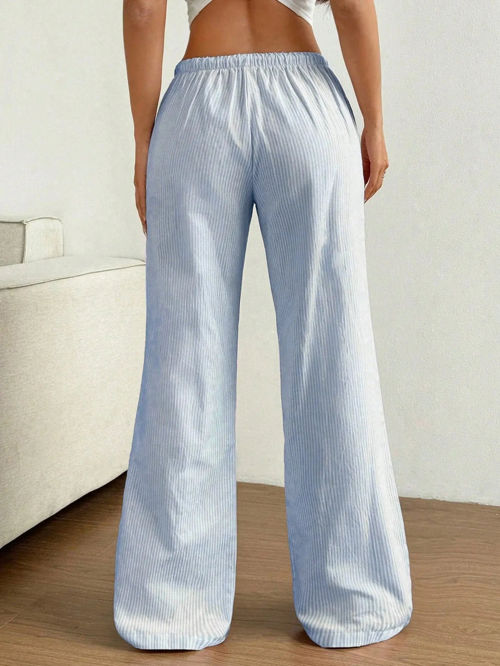 Light pink striped pants on model