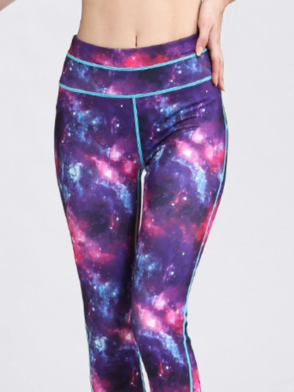 Purple printed workout leggings on model side view