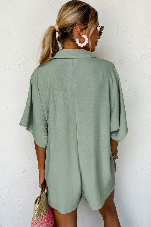 Half sleeve romper side view showing pockets