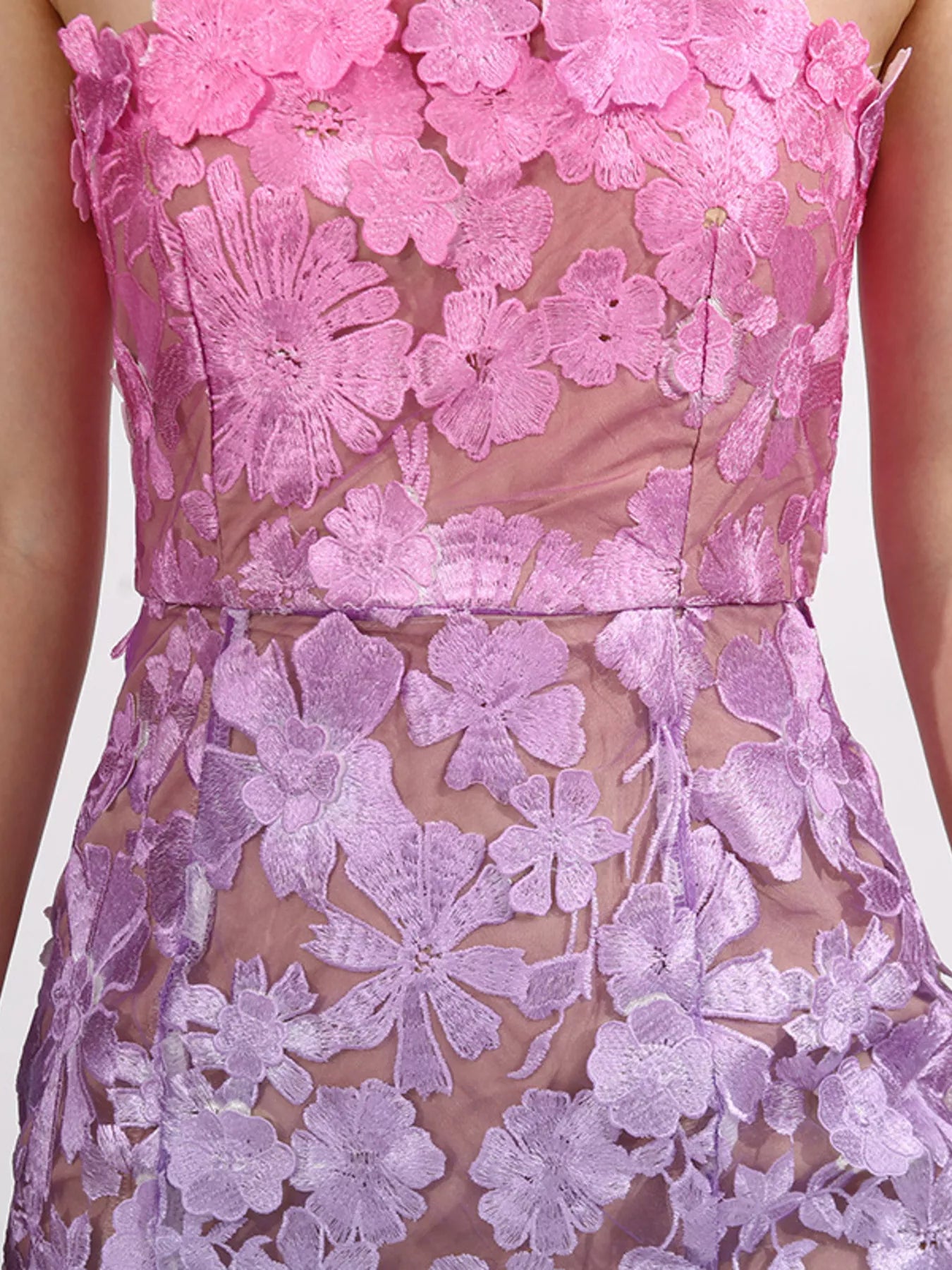 Close up of embroidered floral detail on maxi dress