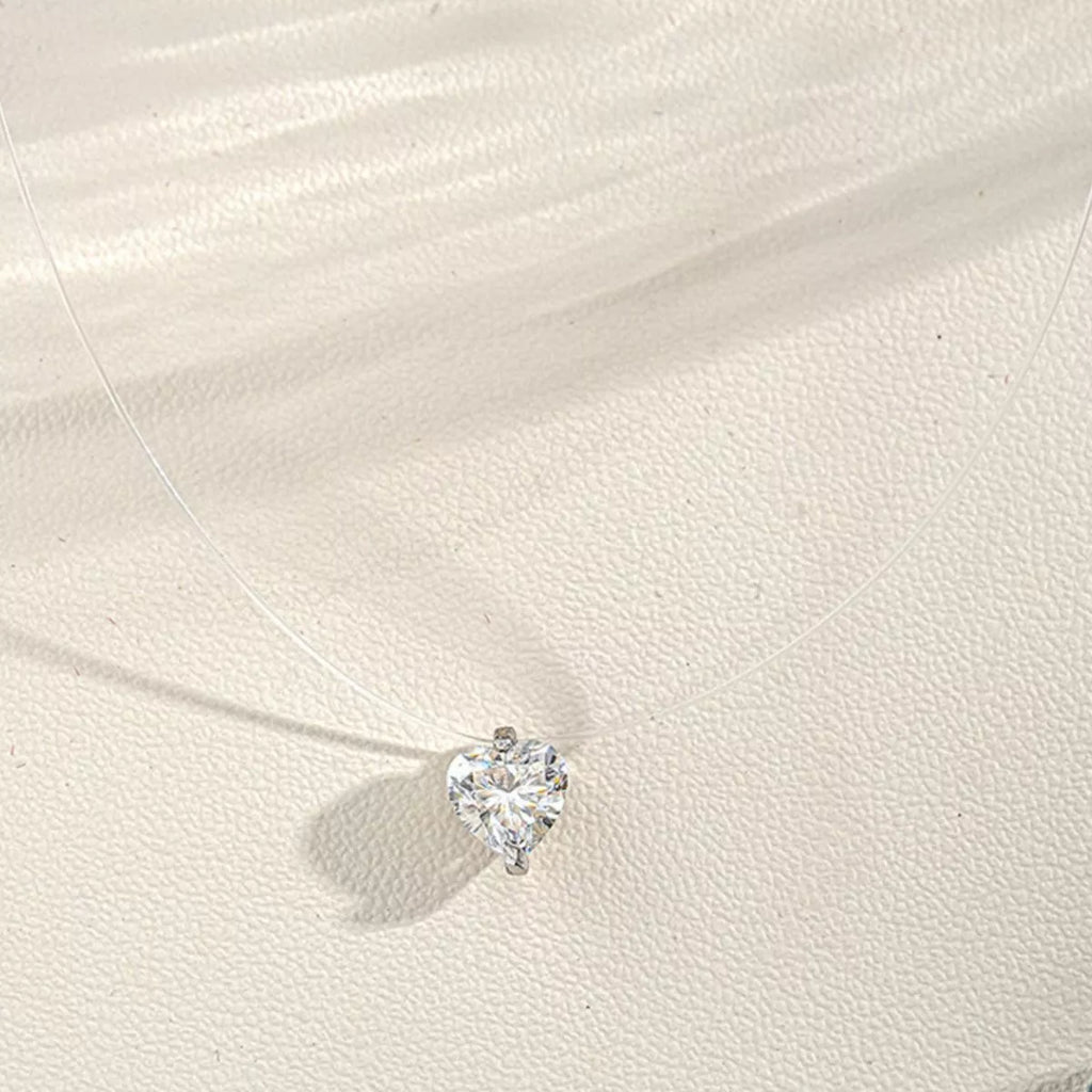Moissanite heart necklace angled sparkle view