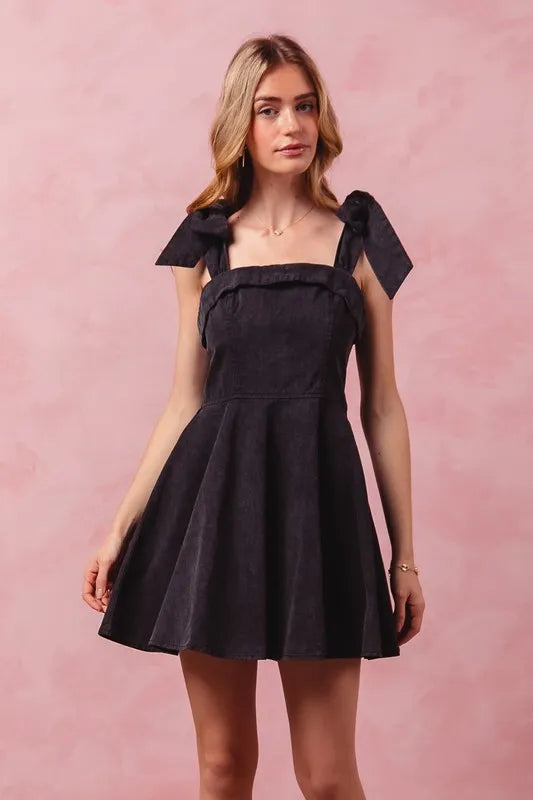 Close up of frill and bow detail on dress