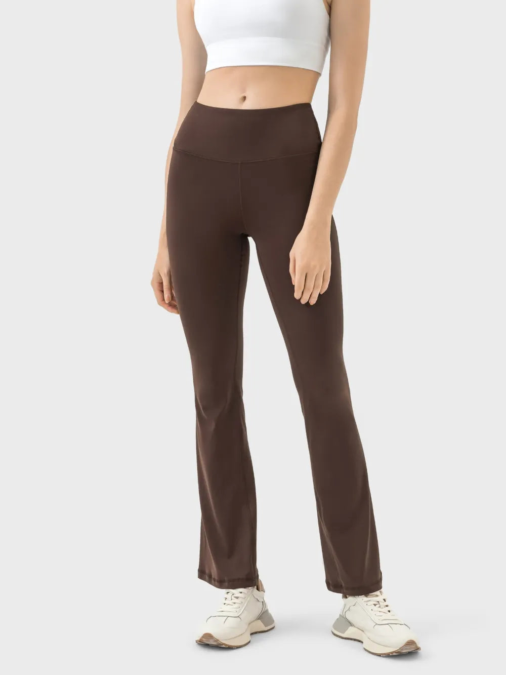 Woman wearing turquoise high waist active pants front view