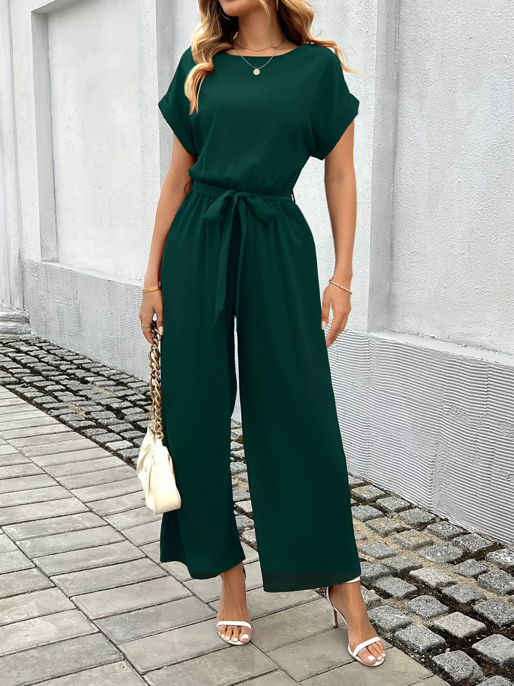 Jumpsuit in green styled with sandals