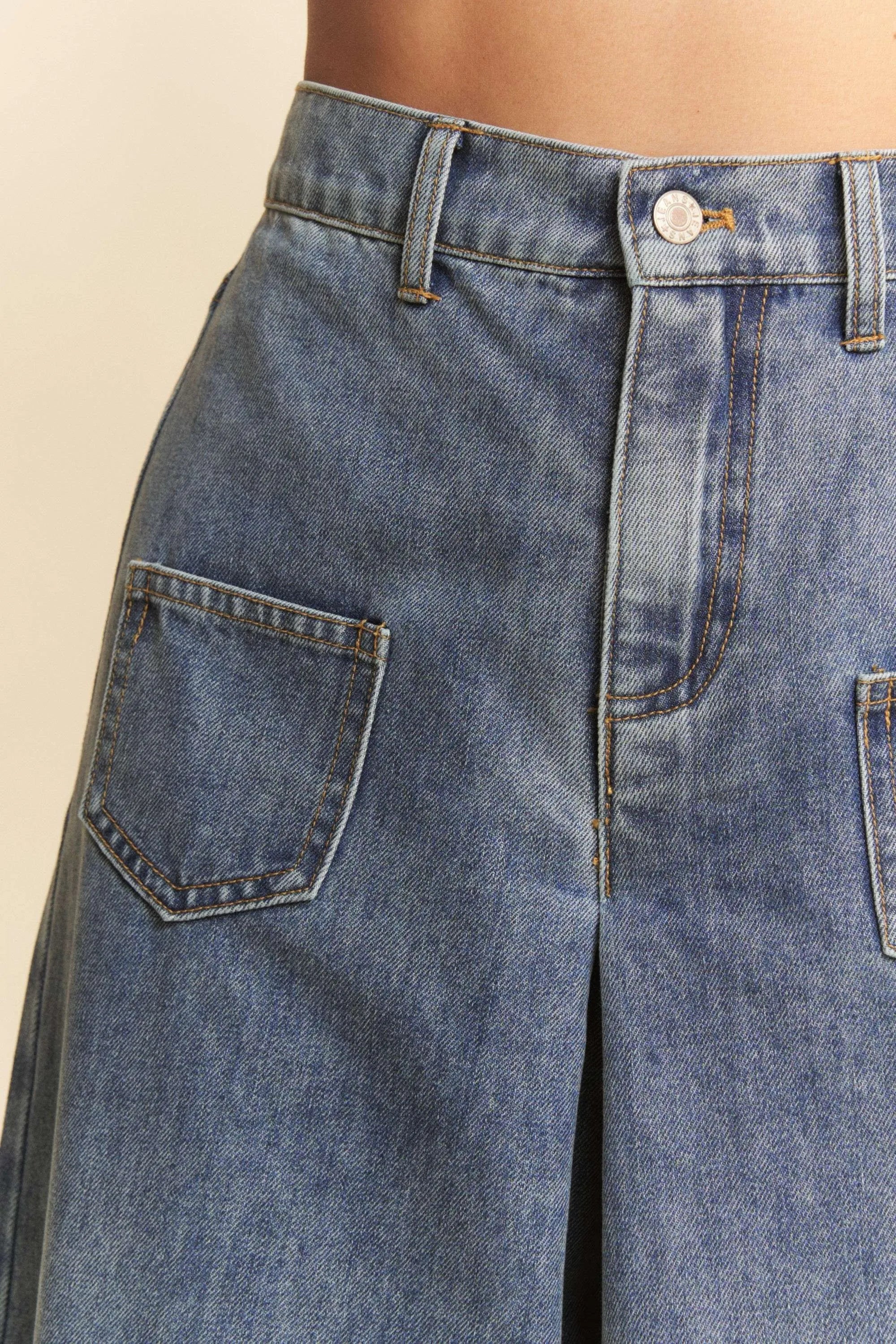 Light wash culotte jeans waist detail