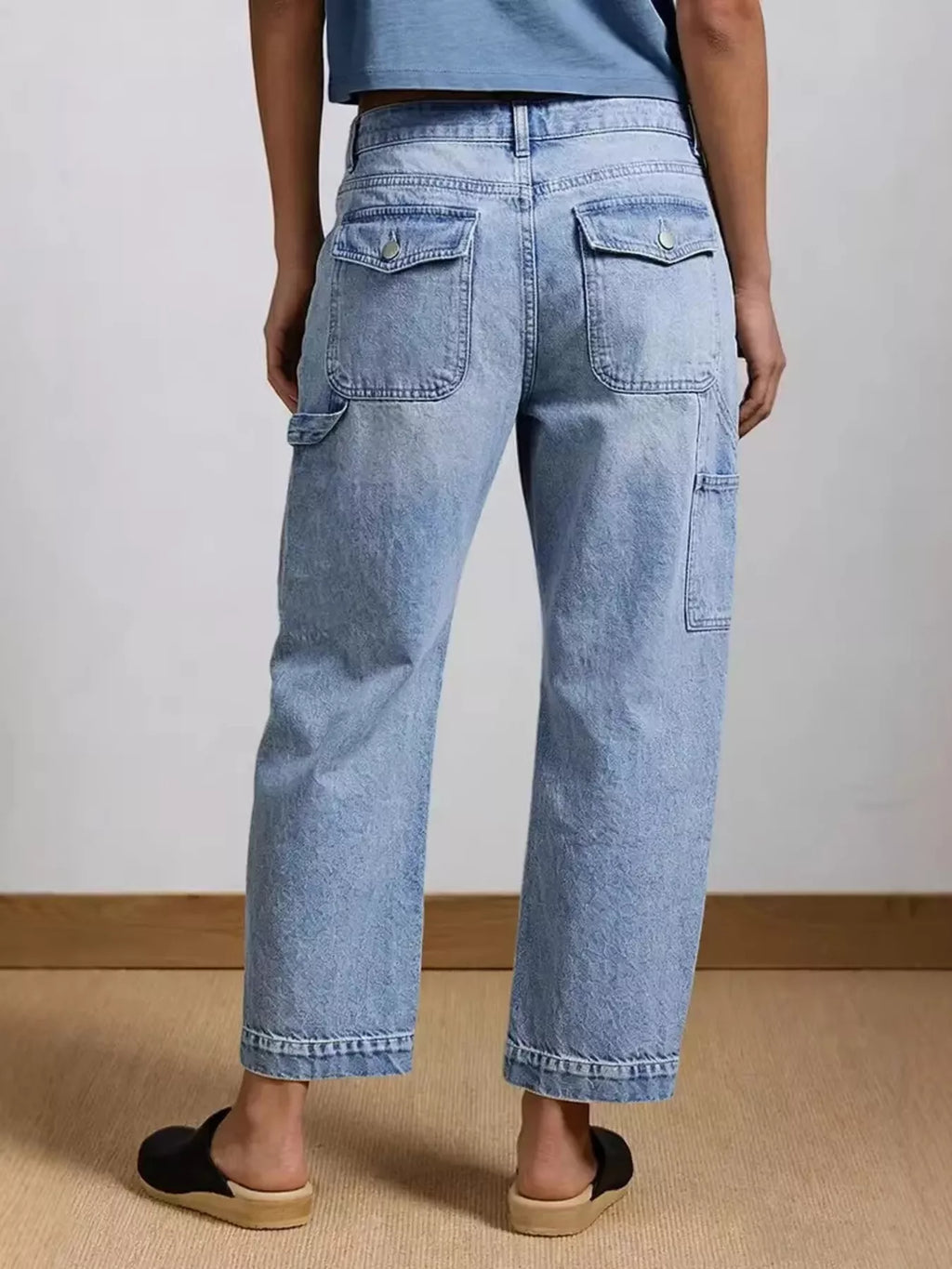 Side view of washed blue wide leg stretch jeans