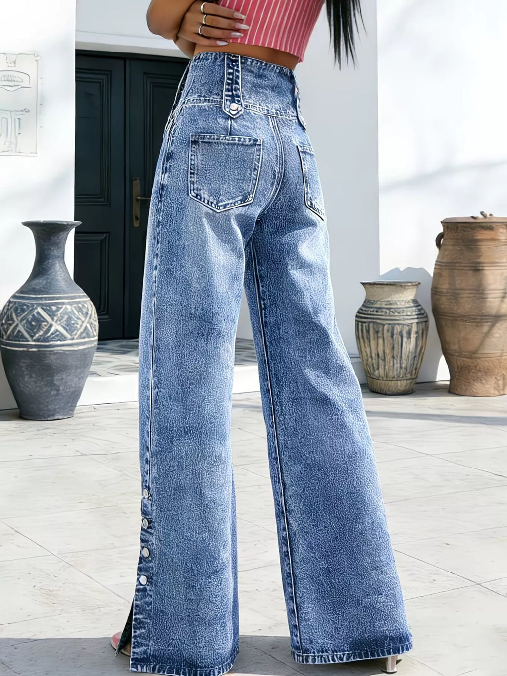 Side view of high waisted button fly wide leg jeans