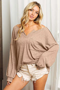 Exposed seam long sleeve top front view in taupe