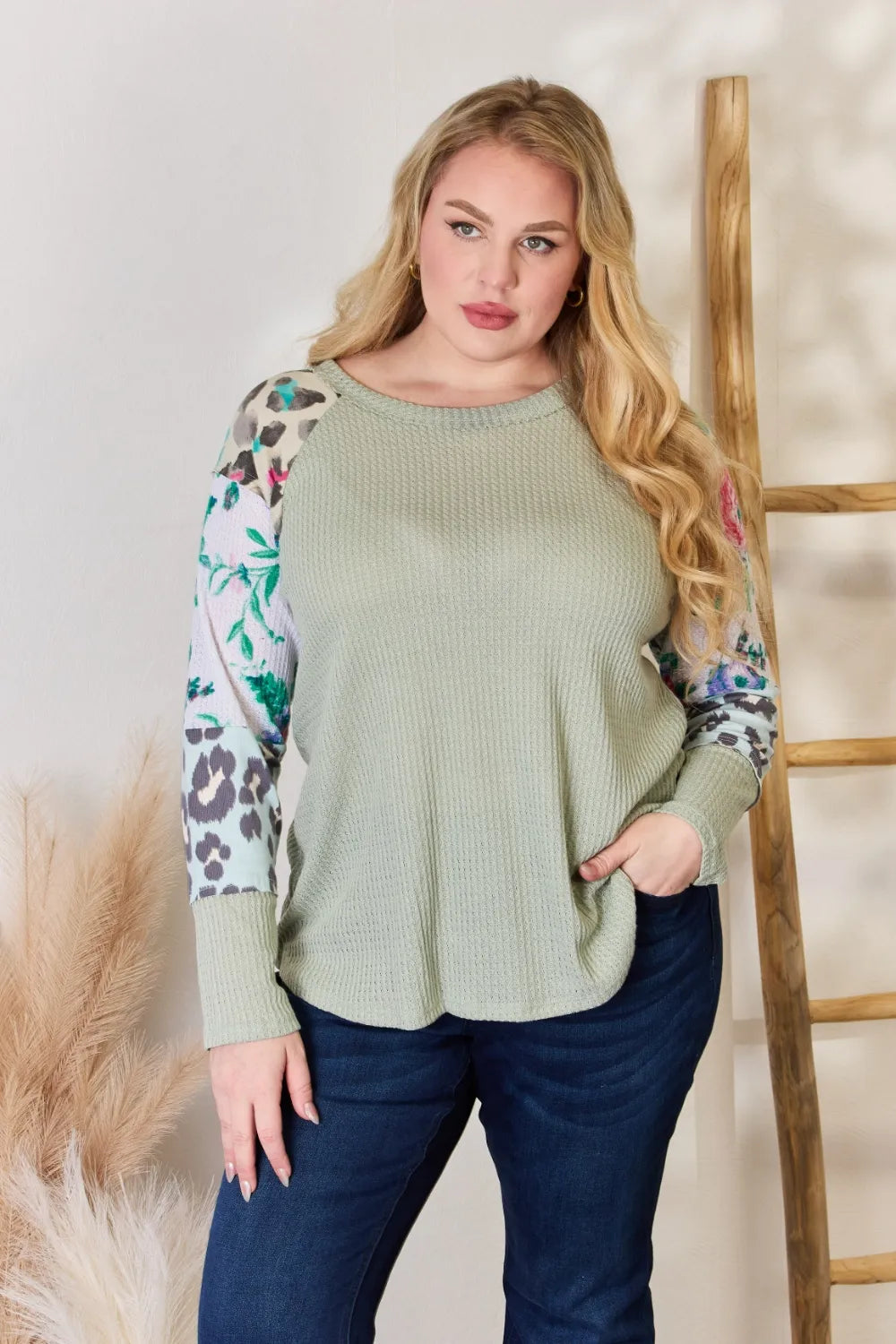 Sage printed blouse styled with trousers