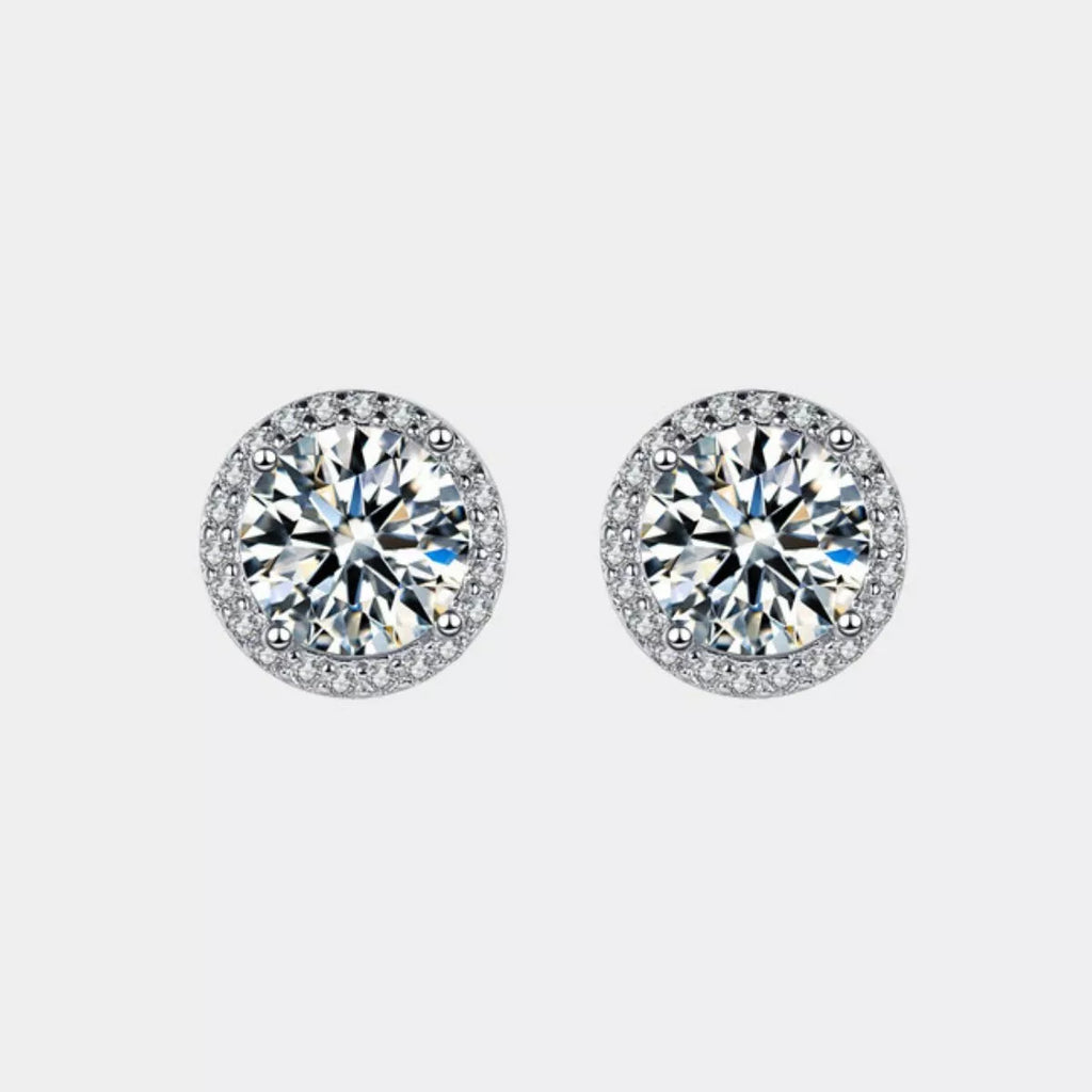 Sterling silver stud earrings on model ear