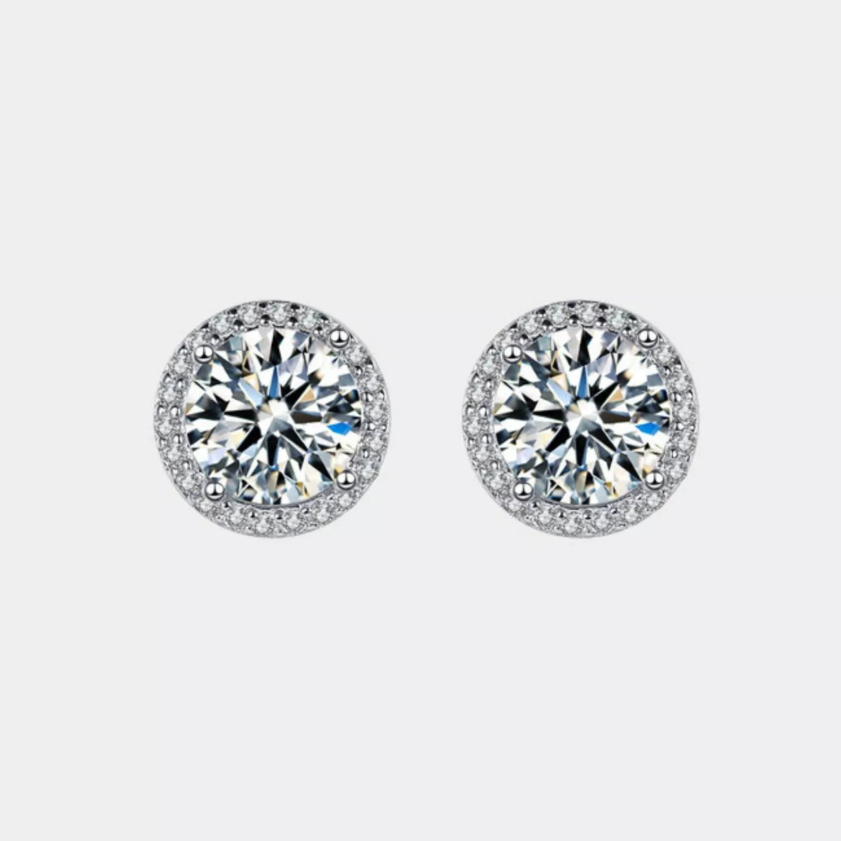 Sterling silver stud earrings on model ear
