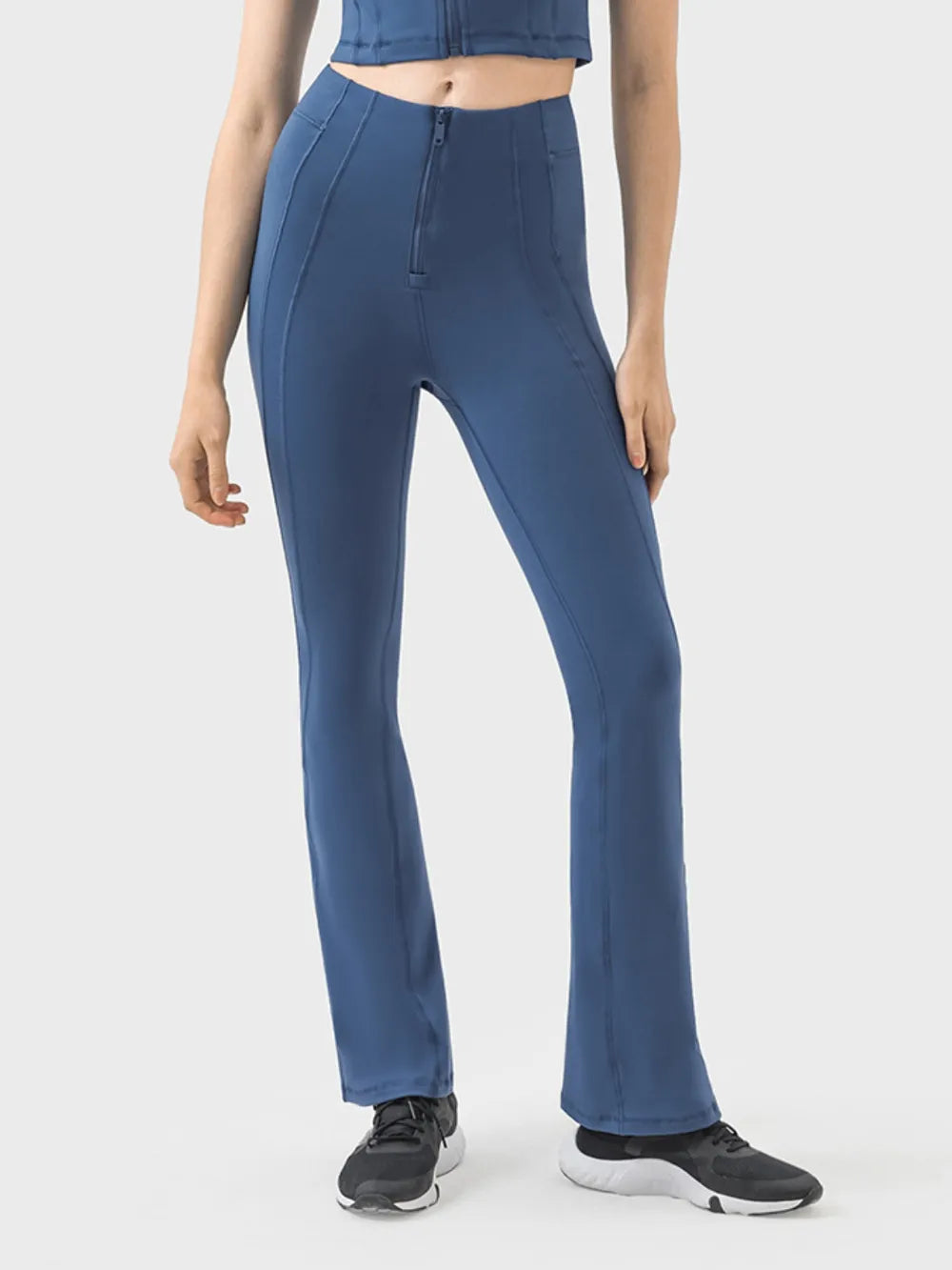 Model wearing high waisted active pants in black