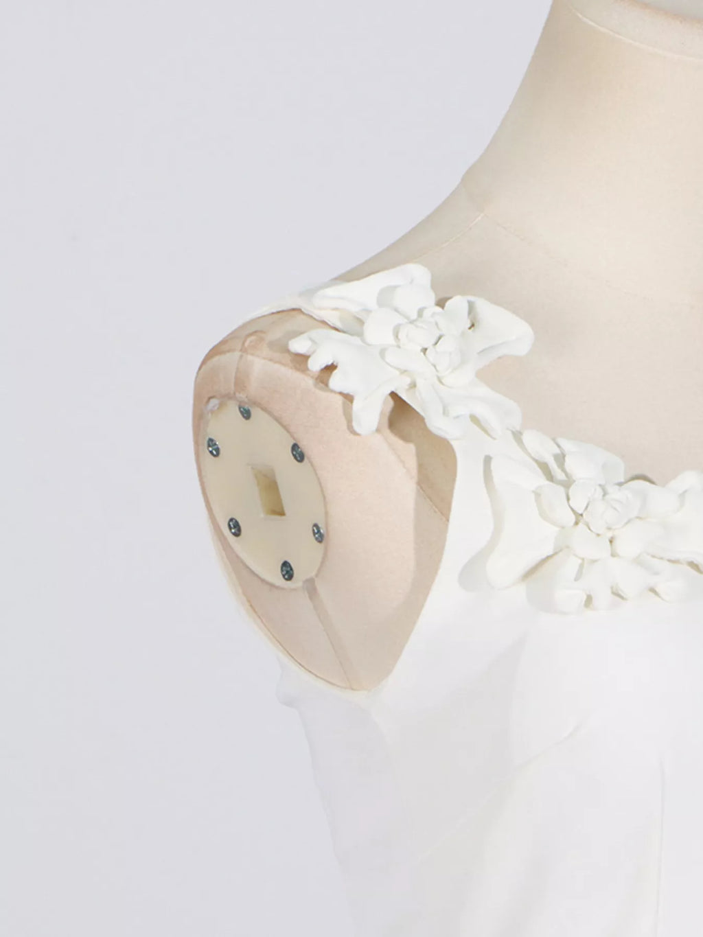 Zipper closure detail on white midi dress