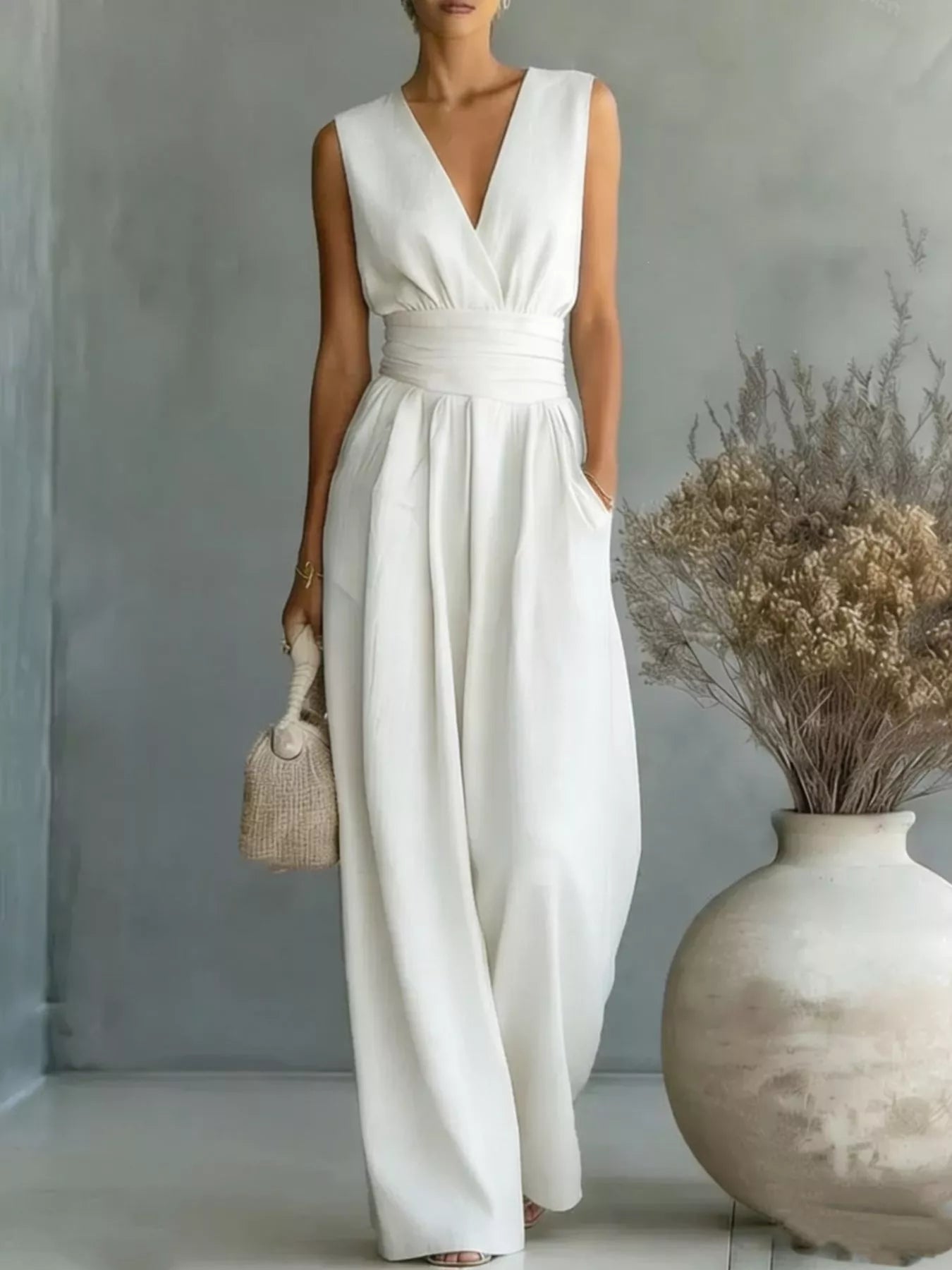 Sleeveless jumpsuit white color front view