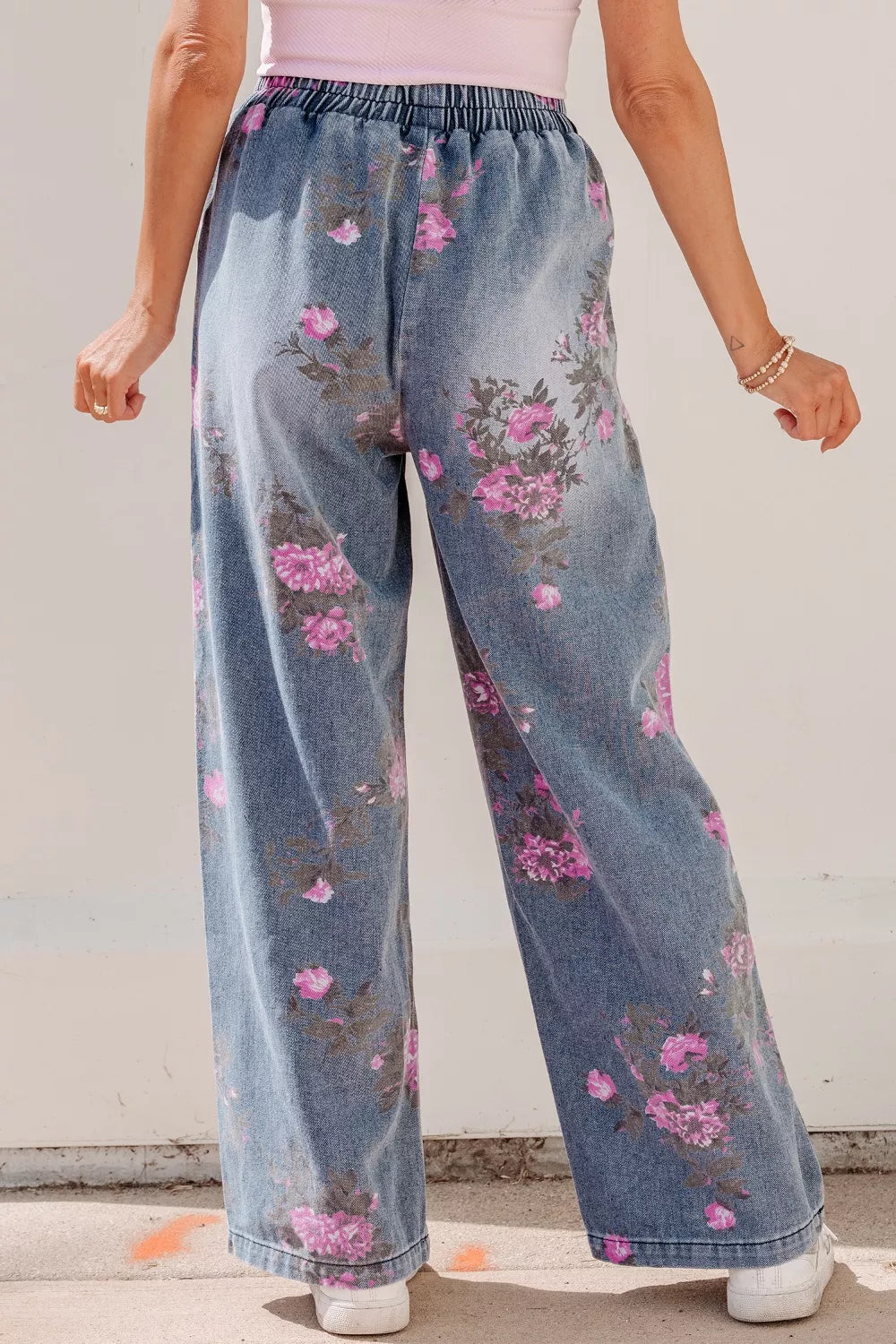 Floral print wide leg jeans back view showing pockets