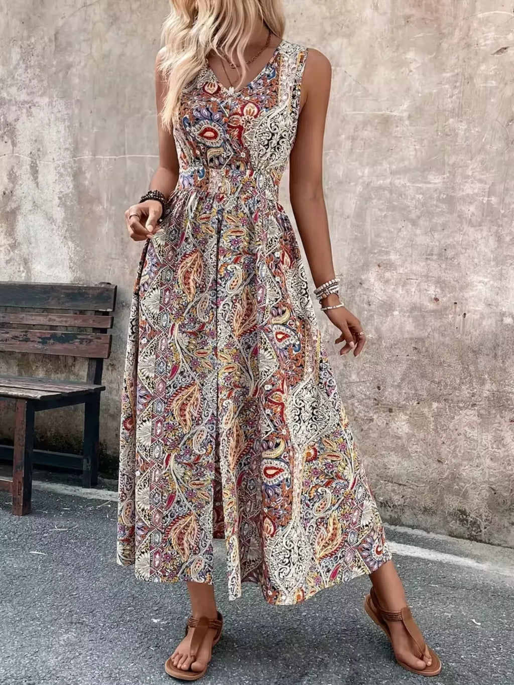 Sleeveless romper side view showing leg slit