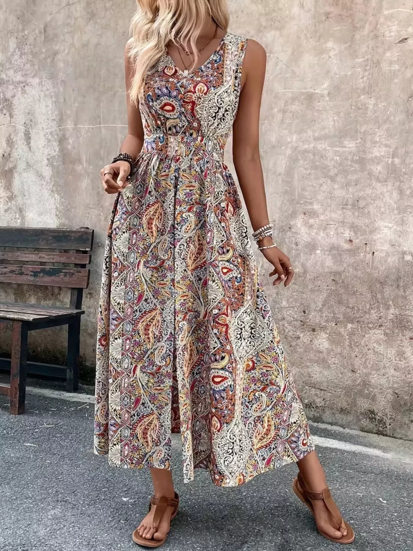 Sleeveless romper side view showing leg slit