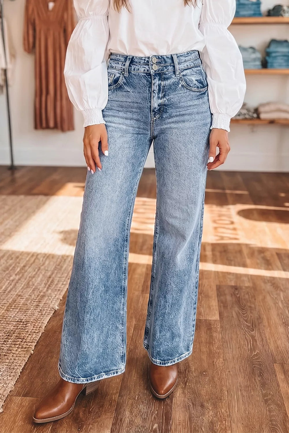Pocket detail on acid wash flare jeans