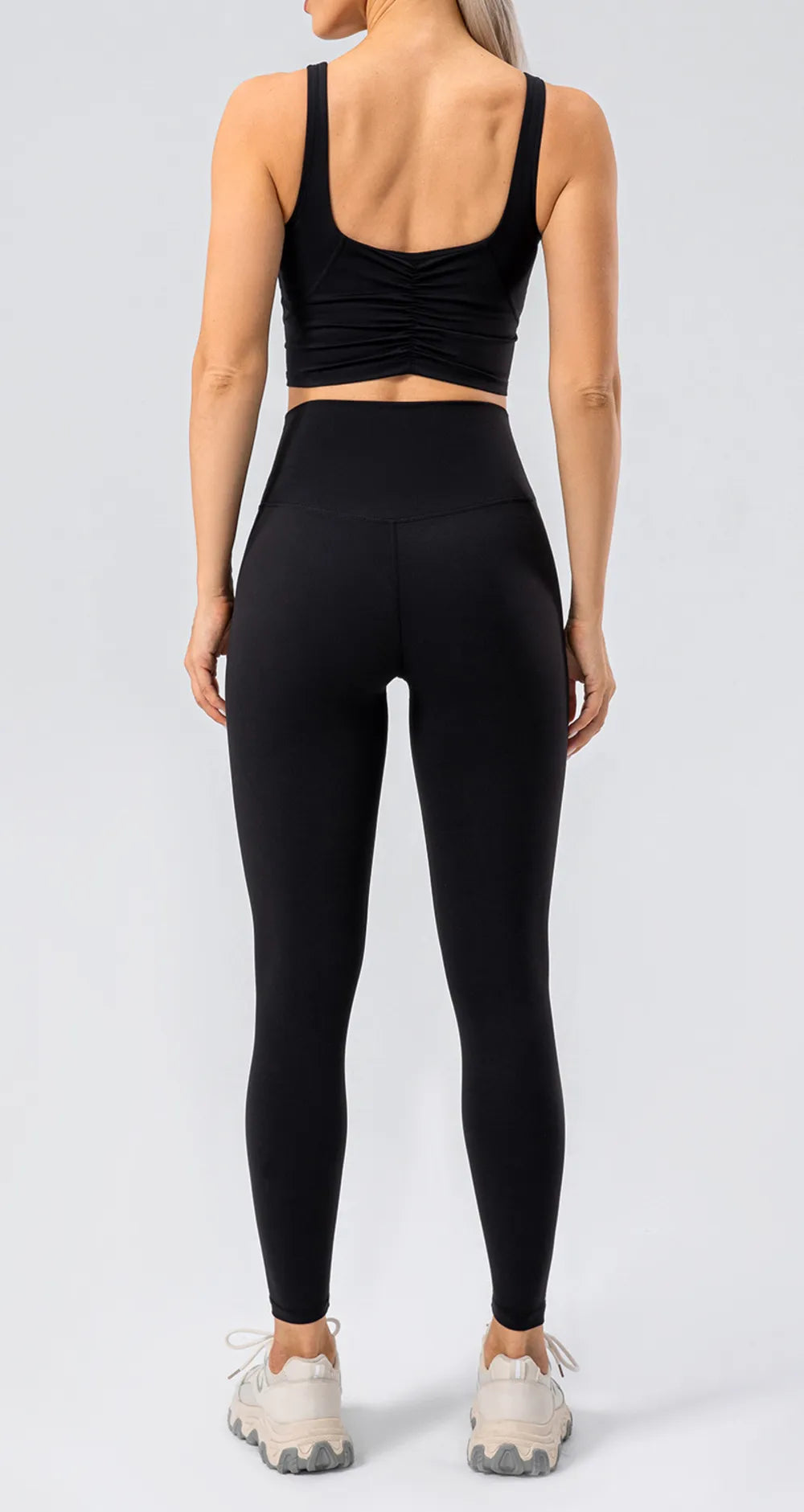 Black workout leggings styled with tank