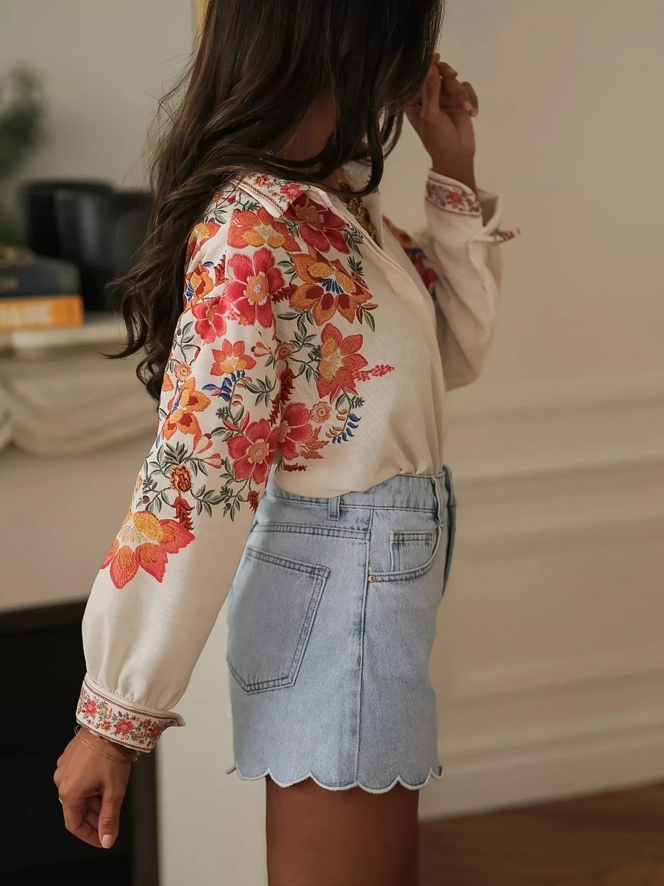 Close up of floral print and button detail