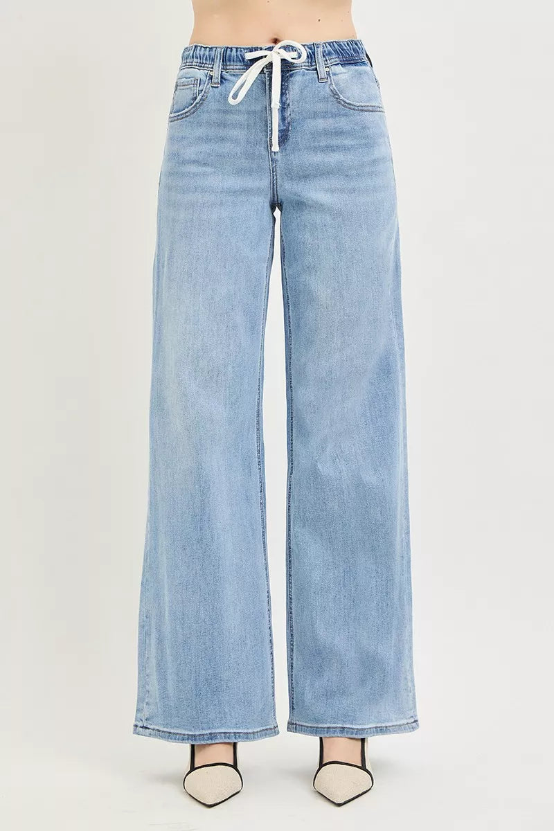 Side view of RISEN slouchy light wash wide leg jeans