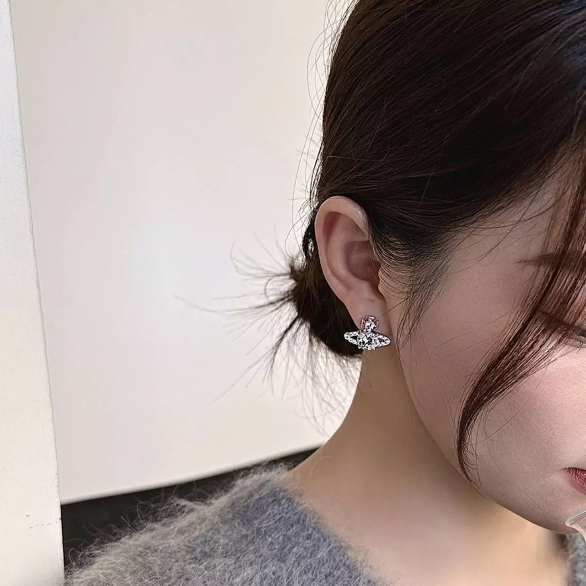 Celestial silver planet earrings detail