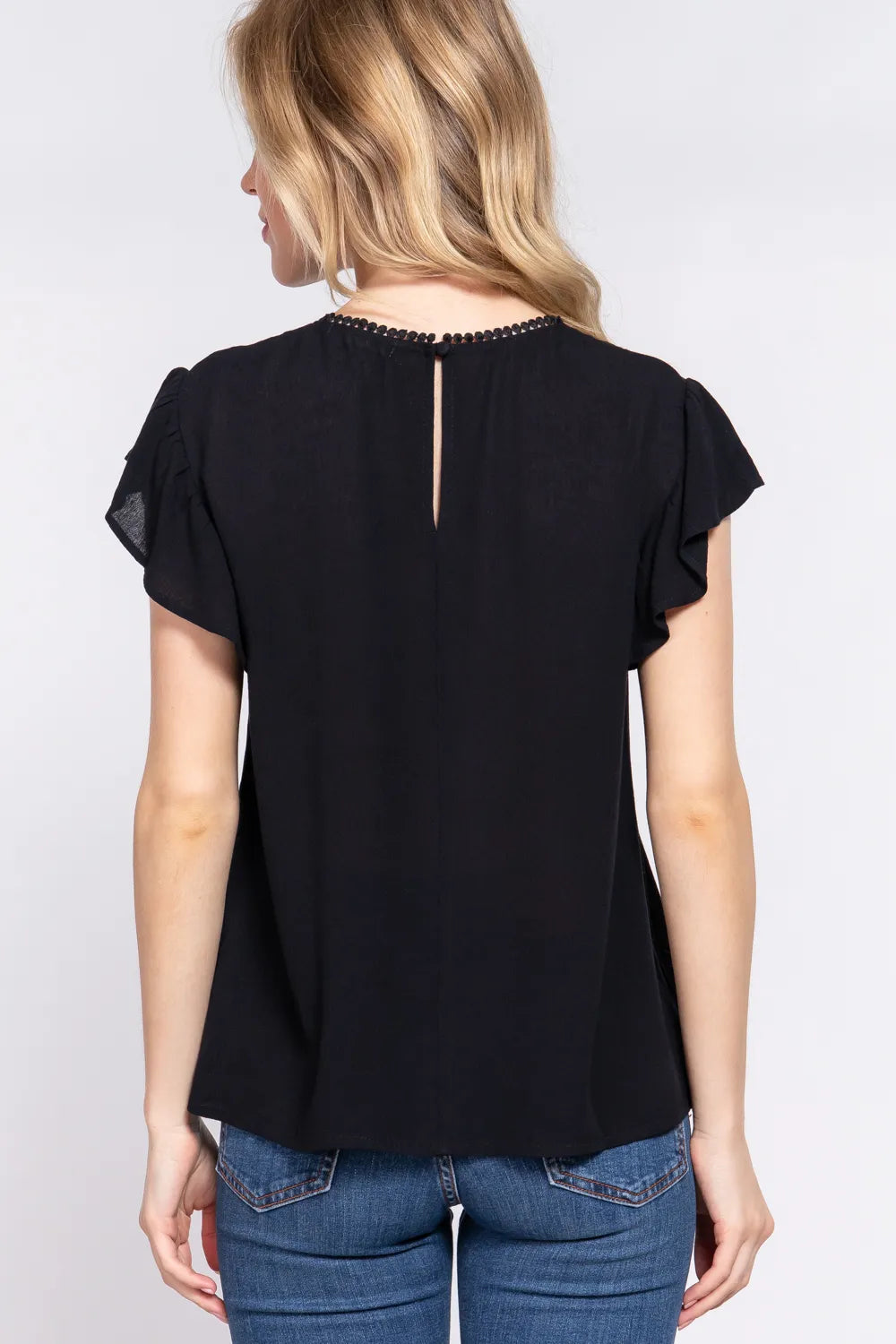 Black crochet ruffle blouse side view