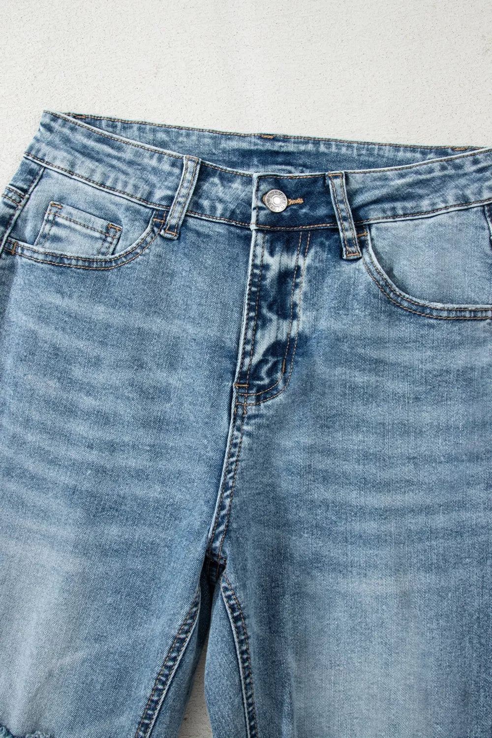 Ripped flare jeans back view